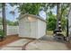 White shed with double doors, patio, and landscaping at 6001 - 8047 S Kings Hwy., Myrtle Beach, SC 29575