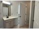 Bathroom with vanity, sink, and access to another room at 608 Pipers Ln. # 608, Myrtle Beach, SC 29575