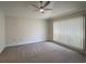 Spacious bedroom with ceiling fan and window coverings at 608 Pipers Ln. # 608, Myrtle Beach, SC 29575