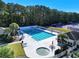 Community lap pool with adjacent tennis courts at 608 Pipers Ln. # 608, Myrtle Beach, SC 29575