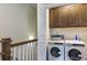 Laundry room with washer, dryer, and storage cabinets at 856 Filliman Alley # C, Myrtle Beach, SC 29577