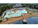 An aerial view of the community pool, lazy river, playground, and pier on the lake at 900 British Ln. # 1187, Myrtle Beach, SC 29579