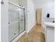 Bathroom featuring a walk-in shower with glass door, tile floors, and chrome shower fixtures at 900 British Ln. # 1187, Myrtle Beach, SC 29579