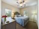 Bedroom with a comfortable bed, side tables, and windows that offer natural light at 900 British Ln. # 1187, Myrtle Beach, SC 29579