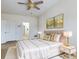 Bright bedroom with a comfortable bed with gold pillows, elegant nightstands, and decorative artwork at 900 British Ln. # 1187, Myrtle Beach, SC 29579