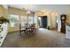 Open dining area with chandelier, carpeted floors, and views of the front entrance at 900 British Ln. # 1187, Myrtle Beach, SC 29579