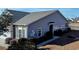 Well-maintained home exterior with tidy landscaping, sidewalk and neutral siding at 900 British Ln. # 1187, Myrtle Beach, SC 29579