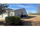 Exterior view featuring neutral siding, shrubs, and well-maintained lawn at 900 British Ln. # 1187, Myrtle Beach, SC 29579