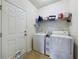 Functional laundry room equipped with a washer, dryer, and ample shelving at 900 British Ln. # 1187, Myrtle Beach, SC 29579