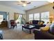Living room with a ceiling fan, dark leather sofas, and a decorative coffee table at 900 British Ln. # 1187, Myrtle Beach, SC 29579