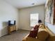 Cozy living room with a comfortable couch, flat screen TV, window letting in natural light, and decorative wall art at 900 British Ln. # 1187, Myrtle Beach, SC 29579
