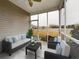 Relaxing screened porch features comfortable seating with beautiful outdoor views at 900 British Ln. # 1187, Myrtle Beach, SC 29579
