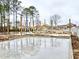 Image shows a construction site with a concrete foundation and wooden framework on a cloudy day at 9107 Marina Pkwy., Myrtle Beach, SC 29572