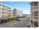 View of building, parking lot, and ocean at 9570 Shore Dr. # 211, Myrtle Beach, SC 29572