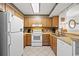 Well-equipped kitchen with ample storage and white appliances at 9570 Shore Dr. # 211, Myrtle Beach, SC 29572