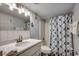 Neat bathroom featuring a modern vanity and a shower with a colorful curtain at 1012 N Waccamaw Dr. # 902, Murrells Inlet, SC 29576