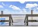 Inviting beach access stairs with ocean views at 1012 N Waccamaw Dr. # 902, Murrells Inlet, SC 29576