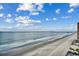 Expansive ocean view with sandy beach and blue skies at 1012 N Waccamaw Dr. # 902, Murrells Inlet, SC 29576