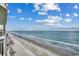 Expansive beach view offering a stunning display of the coastline and ocean from above at 1012 N Waccamaw Dr. # 902, Murrells Inlet, SC 29576
