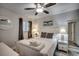 Inviting bedroom with a whale painting, bedside tables and lamps, plus a comfortable bed with pillows at 1012 N Waccamaw Dr. # 902, Murrells Inlet, SC 29576