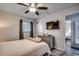 Relaxing bedroom with a television, dresser, and a cozy bed with a view into another bedroom at 1012 N Waccamaw Dr. # 902, Murrells Inlet, SC 29576