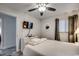 Contemporary bedroom with a television, dresser, a cozy bed, and a door leading to another room at 1012 N Waccamaw Dr. # 902, Murrells Inlet, SC 29576