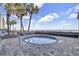 Inviting outdoor hot tub with ocean view and lush palms at 1012 N Waccamaw Dr. # 902, Murrells Inlet, SC 29576