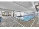Bright indoor pool area with access to outdoor views at 1012 N Waccamaw Dr. # 902, Murrells Inlet, SC 29576