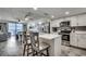 Modern kitchen with white cabinets, marble countertops, stainless steel appliances, and adjacent dining area at 1012 N Waccamaw Dr. # 902, Murrells Inlet, SC 29576