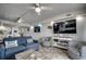 Open-concept living room with modern decor, comfortable seating, and adjacent kitchen/dining area at 1012 N Waccamaw Dr. # 902, Murrells Inlet, SC 29576