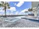 Outdoor pool area features comfortable lounge chairs and tropical palms at 1012 N Waccamaw Dr. # 902, Murrells Inlet, SC 29576