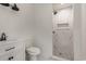 Modern bathroom with a tiled shower, niche, and vanity with matte black hardware at 106 Governor Boone Ln., Georgetown, SC 29440