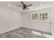 Bedroom showcasing gray wood-look floors, white walls, recessed lighting, and a window at 106 Governor Boone Ln., Georgetown, SC 29440