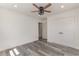 Bedroom boasts gray wood-look floors, white walls, recessed lighting, and a ceiling fan at 106 Governor Boone Ln., Georgetown, SC 29440