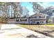 Lovely two-story home with painted brick and siding, an attached garage, fresh landscaping, and a long driveway at 106 Governor Boone Ln., Georgetown, SC 29440