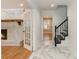 Beautiful foyer boasting marble floors, decorative staircase with iron spindles, and a view to the living room at 106 Governor Boone Ln., Georgetown, SC 29440