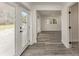 Open hallway showcasing wood-look floors and access to rooms at 106 Governor Boone Ln., Georgetown, SC 29440