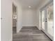 Hallway featuring wood-look floors, light walls, and french doors leading to the outside at 106 Governor Boone Ln., Georgetown, SC 29440