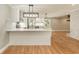 Modern kitchen with white cabinets, marble countertops, and stainless steel appliances at 106 Governor Boone Ln., Georgetown, SC 29440