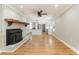 Bright living room boasts hardwood floors, a brick fireplace, and an open view to the modern kitchen at 106 Governor Boone Ln., Georgetown, SC 29440