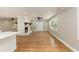 Bright living room featuring a brick fireplace and hardwood floors at 106 Governor Boone Ln., Georgetown, SC 29440