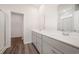 Double vanity bathroom with gray cabinets and a shower at 1106 Black Lake Way, Conway, SC 29526