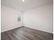 Bright bedroom with wood-look floors and a window offering a view at 1106 Black Lake Way, Conway, SC 29526