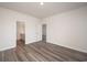 Spacious bedroom with wood-look floors and access to a bathroom at 1106 Black Lake Way, Conway, SC 29526
