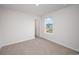 Well-lit bedroom with carpet and a window at 1106 Black Lake Way, Conway, SC 29526