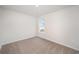 Bright bedroom featuring a window with natural light and neutral carpeting at 1106 Black Lake Way, Conway, SC 29526