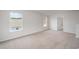 Bonus room featuring carpet, two windows, and an open floor plan at 1106 Black Lake Way, Conway, SC 29526
