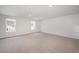 Spacious bonus room with carpet and two windows at 1106 Black Lake Way, Conway, SC 29526