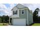 Two-story house with gray siding, white accents, and a two-car garage at 1106 Black Lake Way, Conway, SC 29526