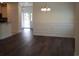 Dining room with hardwood floors and white wainscoting at 1143 Freeboard St. # 203, Murrells Inlet, SC 29576